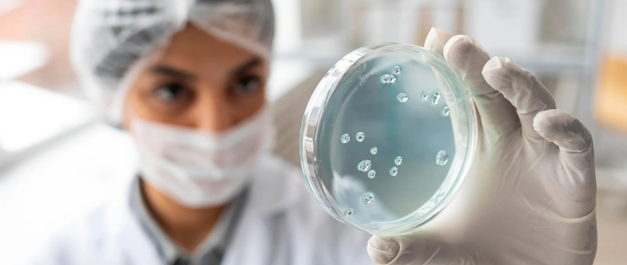 Woman checking microbes.