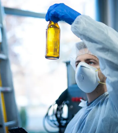 Person checking bottle.