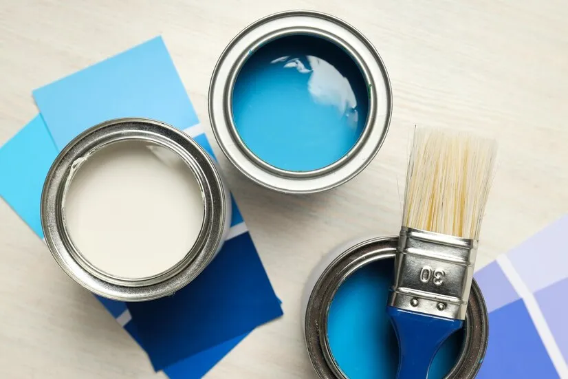 Paints on the table.